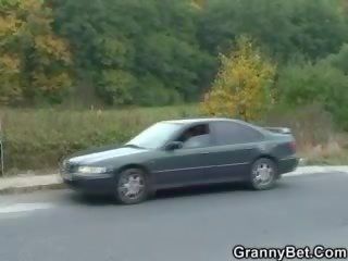 Granny escort is picked up and fucked